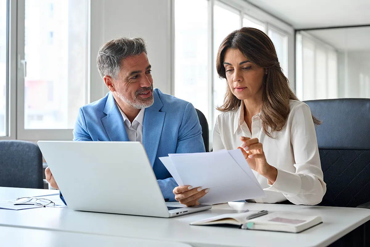 Man and woman going over SEM campaign results.