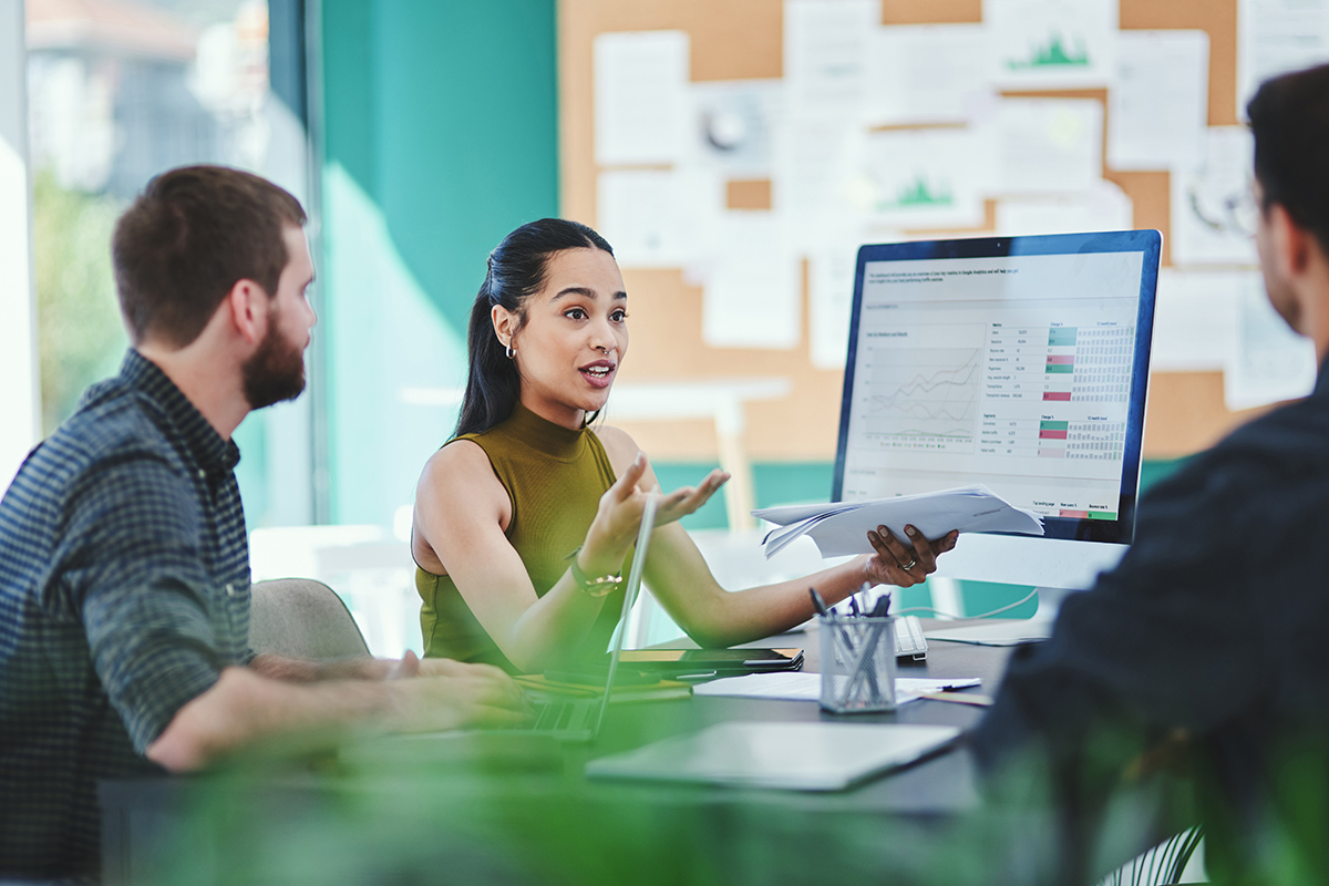 Creative, business people and team discussion with documents in meeting for brand or target audience. Group, campaign manager and planning with chart for ads, performance data or strategy in startup.