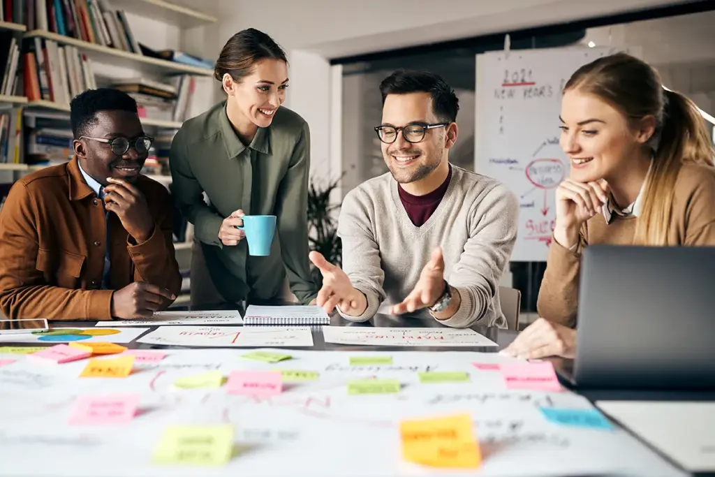 Marketing team looking at ideas on table