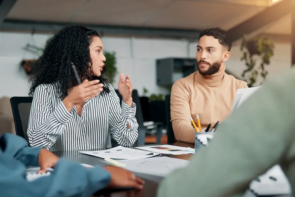 Woman and man discussing presentation.