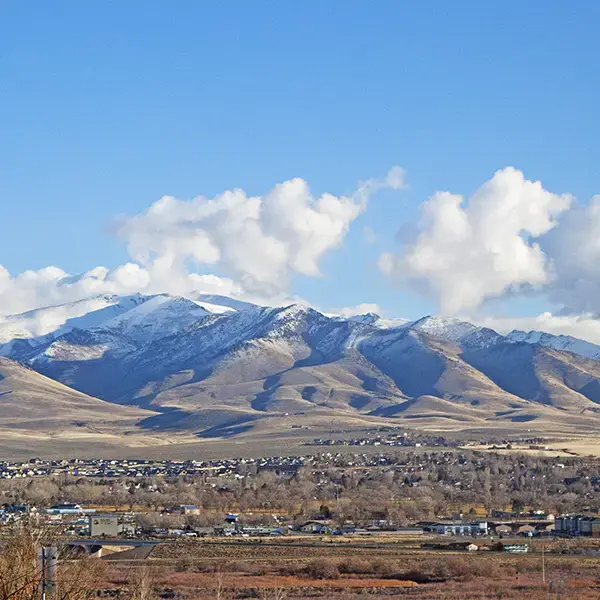 Mountains, blue sky and a few puffy clouds